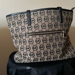 Michael Kors show the bag with MK emblems all over